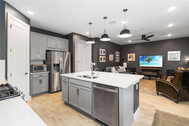 971 Braewood Dr, Clermont, FL 34715 - kitchen with stainless steel appliances, open floor plan, light wood finished floors, and recessed lighting