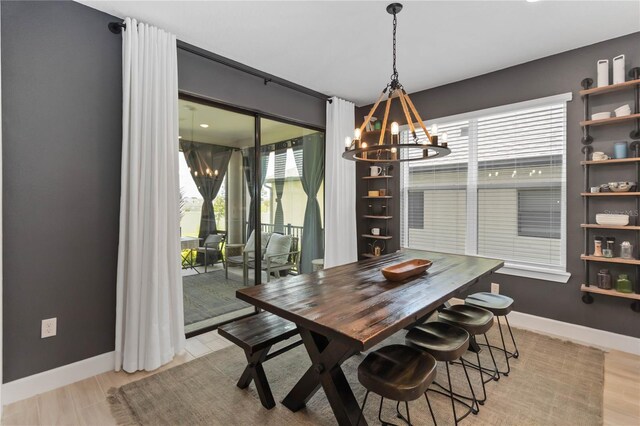 971 Braewood Dr, Clermont, FL 34715 - dining room with a chandelier and light wood-type flooring