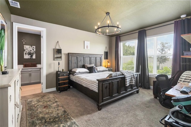 971 Braewood Dr, Clermont, FL 34715 - bedroom with light colored carpet, a chandelier, a textured ceiling, and ensuite bath