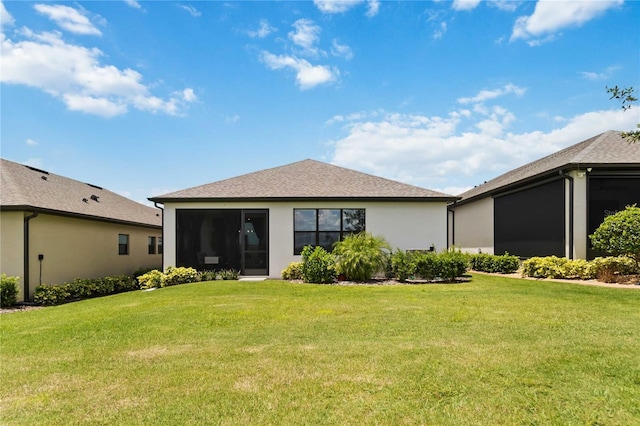 971 Braewood Dr, Clermont, FL 34715 - rear view of house featuring a lawn, a shingled roof, and stucco siding
