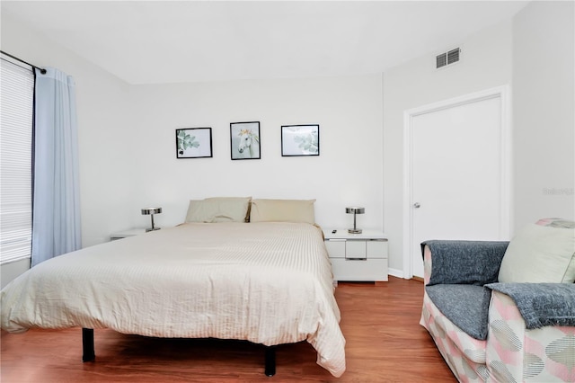 5566 Metrowest Blvd Unit 10, Orlando, FL 32811 - bedroom featuring wood finished floors