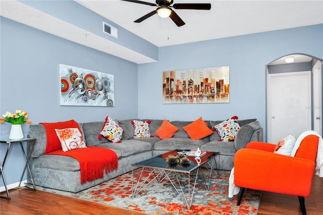 5566 Metrowest Blvd Unit 10, Orlando, FL 32811 - living room featuring arched walkways, wood finished floors, and ceiling fan