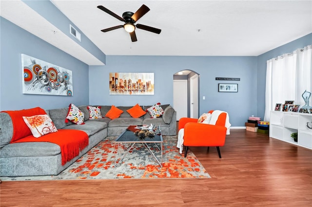 5566 Metrowest Blvd Unit 10, Orlando, FL 32811 - living room with arched walkways, ceiling fan, and wood finished floors