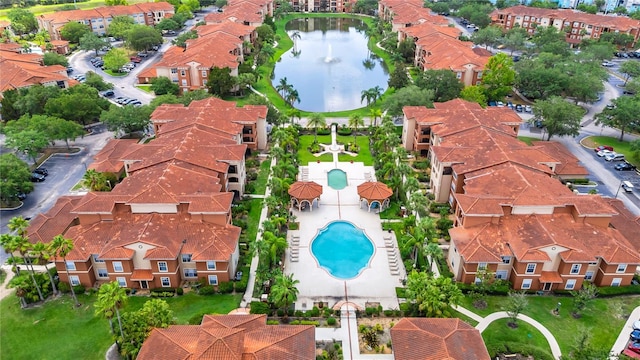 5566 Metrowest Blvd Unit 10, Orlando, FL 32811 - drone / aerial view of a pool area and a nearby body of water