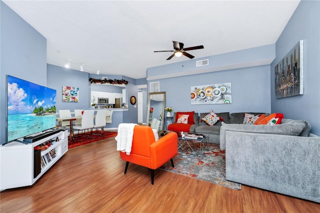 5566 Metrowest Blvd Unit 10, Orlando, FL 32811 - living area with wood finished floors and a ceiling fan