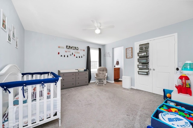 609 Big Pine Ave, Minneola, FL 34715 - bedroom with a crib, carpet, and ceiling fan