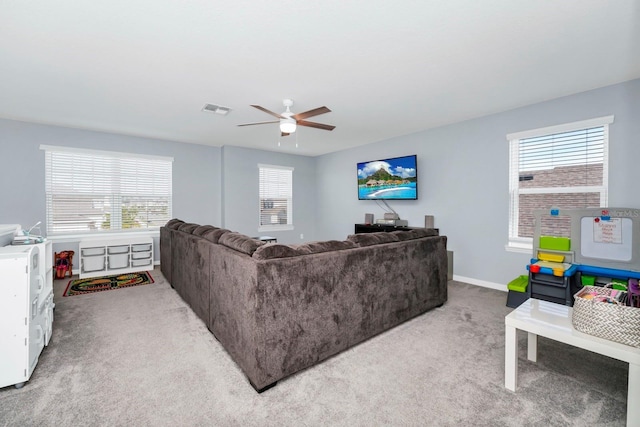 609 Big Pine Ave, Minneola, FL 34715 - carpeted living area with plenty of natural light and a ceiling fan