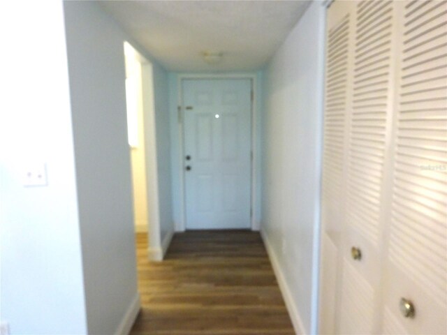 2864 N Powers Dr Unit 156, Orlando, FL 32818 - hallway with dark wood-type flooring and baseboards