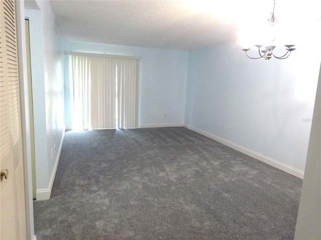 2864 N Powers Dr Unit 156, Orlando, FL 32818 - empty room with carpet floors and a chandelier