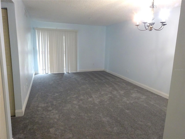2864 N Powers Dr Unit 156, Orlando, FL 32818 - spare room with a chandelier, carpet floors, and a textured ceiling