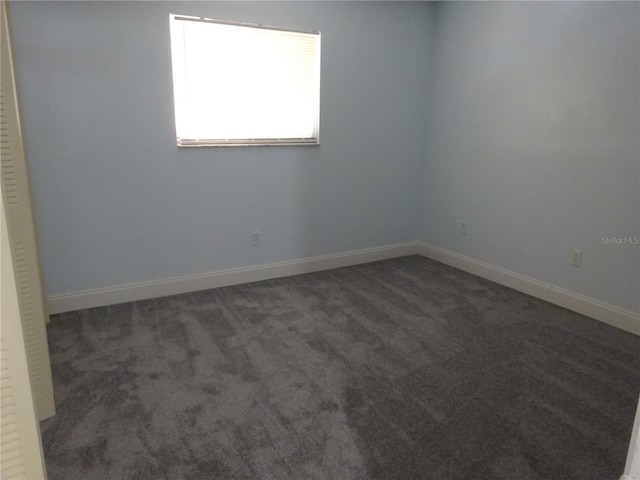2864 N Powers Dr Unit 156, Orlando, FL 32818 - carpeted empty room with baseboards