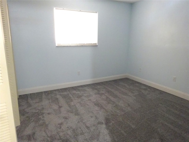 2864 N Powers Dr Unit 156, Orlando, FL 32818 - empty room featuring carpet and baseboards