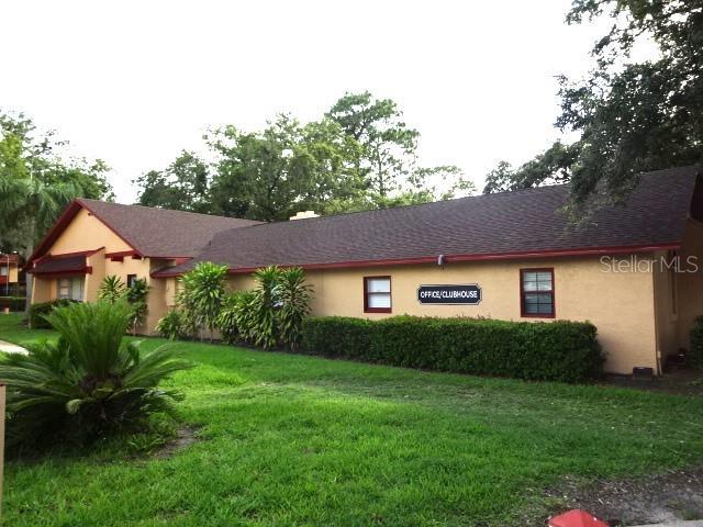 2864 N Powers Dr Unit 156, Orlando, FL 32818 - ranch-style home featuring stucco siding and a front yard