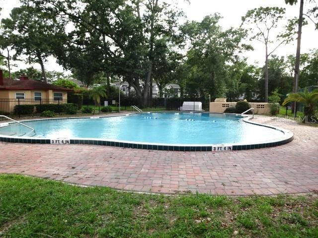 2864 N Powers Dr Unit 156, Orlando, FL 32818 - community pool with a patio