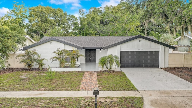 1921 Heathwood Dr, Winter Park, FL 32792 - mid-century inspired home with an attached garage and driveway