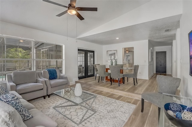 1921 Heathwood Dr, Winter Park, FL 32792 - living room with a ceiling fan, wood finished floors, vaulted ceiling, and french doors