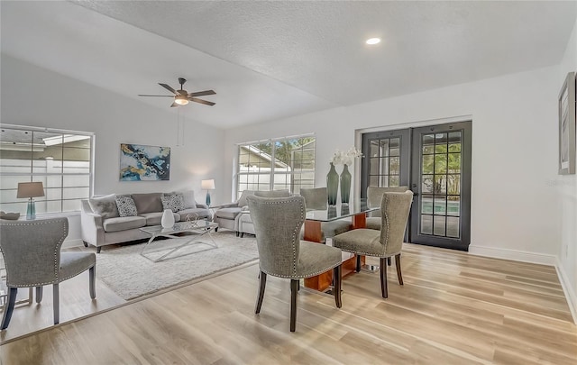1921 Heathwood Dr, Winter Park, FL 32792 - dining area featuring french doors, light wood-type flooring, plenty of natural light, vaulted ceiling, and ceiling fan
