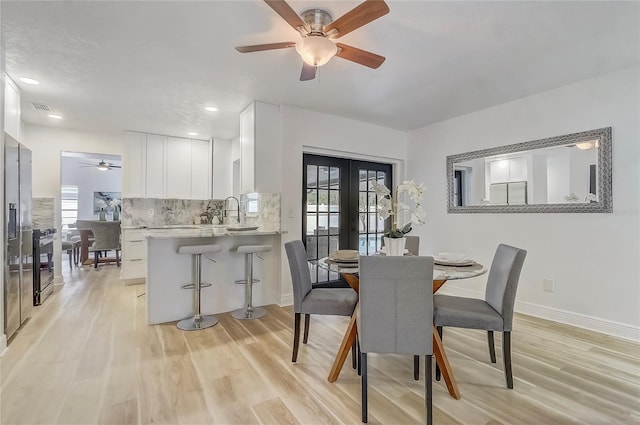 1921 Heathwood Dr, Winter Park, FL 32792 - dining space with a ceiling fan, light wood finished floors, and french doors