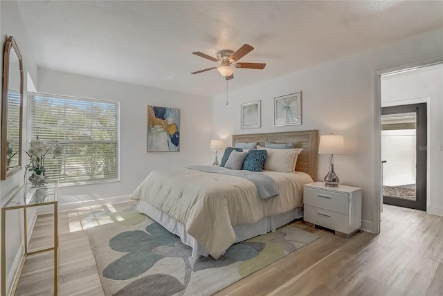 1921 Heathwood Dr, Winter Park, FL 32792 - bedroom with light wood finished floors and a ceiling fan