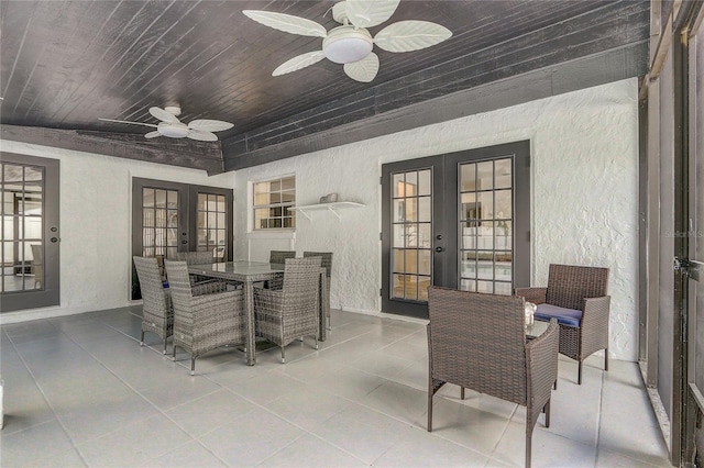1921 Heathwood Dr, Winter Park, FL 32792 - dining area with french doors, a textured wall, wooden ceiling, ceiling fan, and tile patterned floors