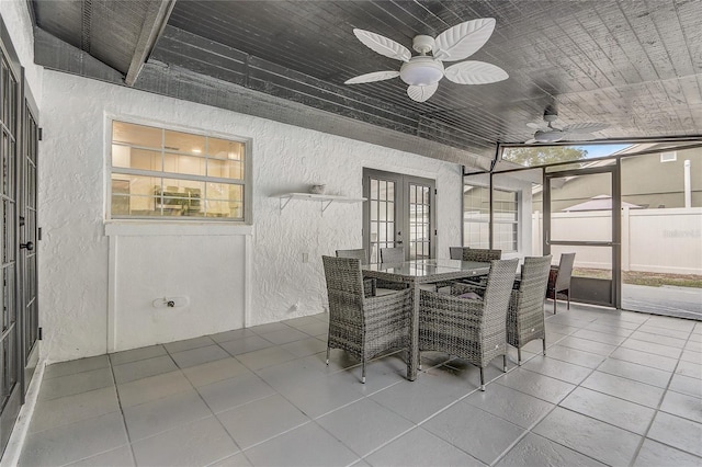 1921 Heathwood Dr, Winter Park, FL 32792 - tiled dining room featuring a textured wall, french doors, plenty of natural light, and ceiling fan