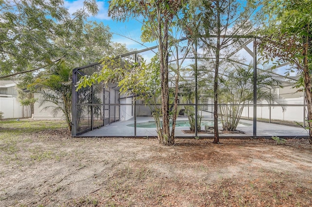 1921 Heathwood Dr, Winter Park, FL 32792 - back of house featuring glass enclosure and a patio
