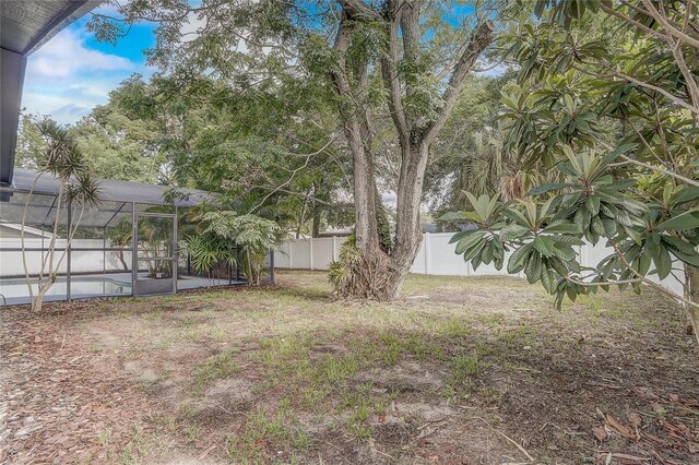 1921 Heathwood Dr, Winter Park, FL 32792 - fenced backyard featuring glass enclosure