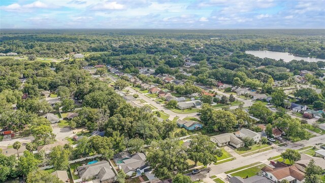 1921 Heathwood Dr, Winter Park, FL 32792 - aerial view of residential area featuring a heavily wooded area and a nearby body of water