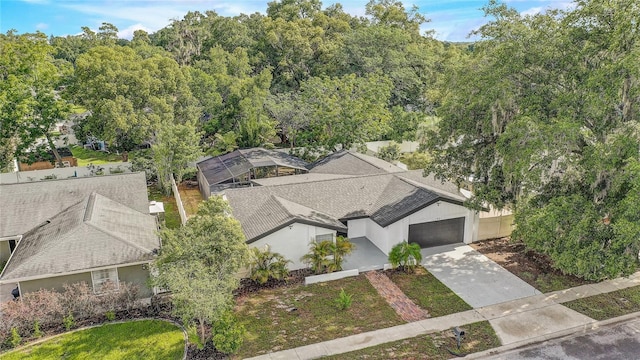 1921 Heathwood Dr, Winter Park, FL 32792 - aerial view of property and surrounding area with a heavily wooded area