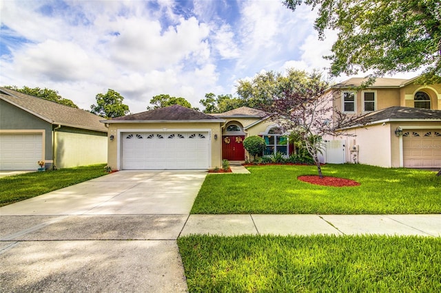 2031 Wekiva Reserve Blvd, Apopka, FL 32703 - view of front facade with stucco siding, driveway, a front yard, and a garage