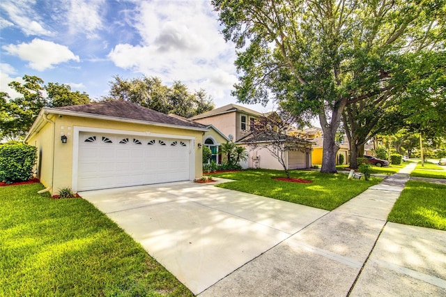 2031 Wekiva Reserve Blvd, Apopka, FL 32703 - view of front of house with stucco siding, concrete driveway, a front lawn, and an attached garage