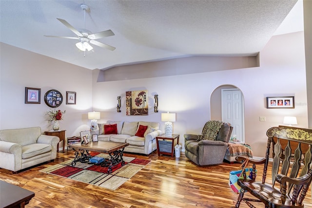 2031 Wekiva Reserve Blvd, Apopka, FL 32703 - living area featuring vaulted ceiling, arched walkways, wood finished floors, and a ceiling fan