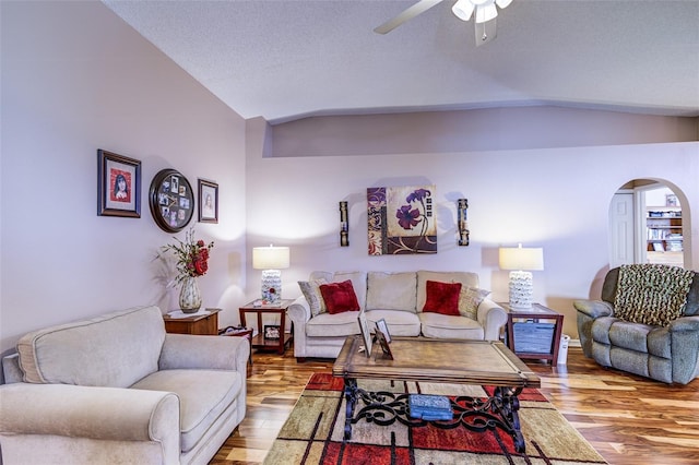 2031 Wekiva Reserve Blvd, Apopka, FL 32703 - living area featuring lofted ceiling, arched walkways, wood finished floors, and a ceiling fan