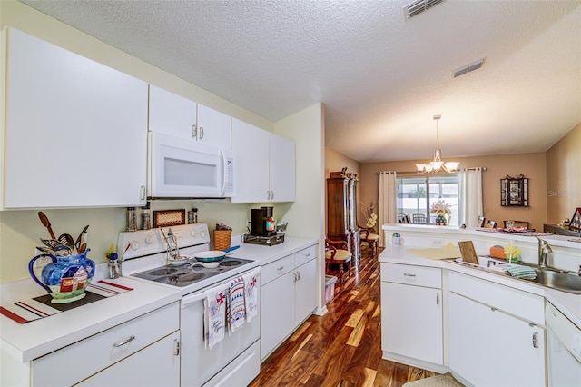2031 Wekiva Reserve Blvd, Apopka, FL 32703 - kitchen featuring white appliances, dark wood-style floors, a chandelier, light countertops, and a textured ceiling