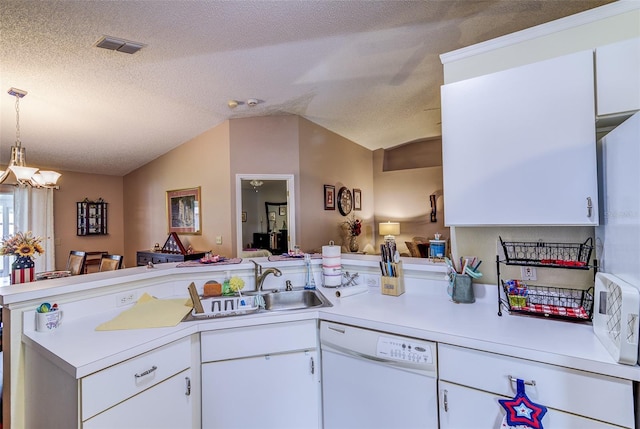 2031 Wekiva Reserve Blvd, Apopka, FL 32703 - kitchen featuring white dishwasher, a peninsula, light countertops, lofted ceiling, and open floor plan