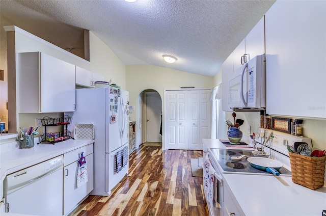 2031 Wekiva Reserve Blvd, Apopka, FL 32703 - kitchen featuring white appliances, lofted ceiling, white cabinets, a textured ceiling, and light countertops