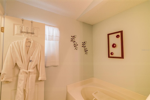 2031 Wekiva Reserve Blvd, Apopka, FL 32703 - bathroom with a bath and a textured ceiling
