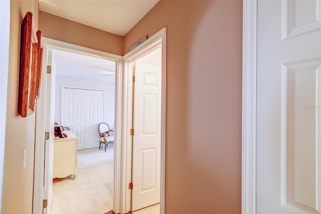 2031 Wekiva Reserve Blvd, Apopka, FL 32703 - hallway with light carpet and a textured ceiling