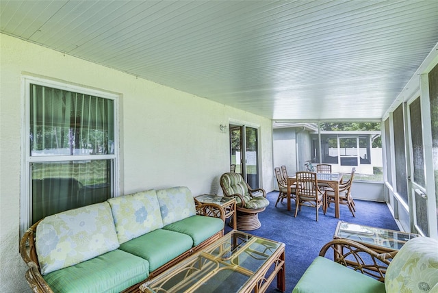 2031 Wekiva Reserve Blvd, Apopka, FL 32703 - sunroom with outdoor dining area, carpet floors, and an outdoor living space
