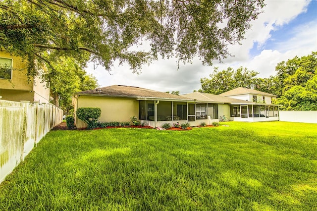 2031 Wekiva Reserve Blvd, Apopka, FL 32703 - rear view of house featuring a sunroom and stucco siding