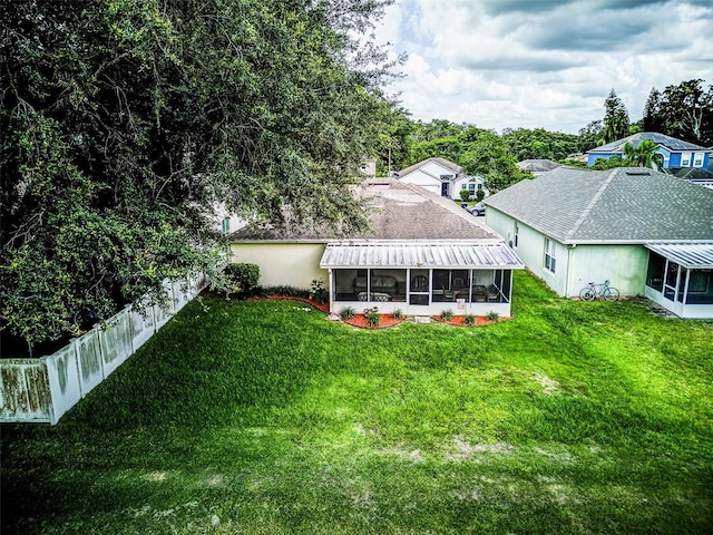2031 Wekiva Reserve Blvd, Apopka, FL 32703 - rear view of property with a sunroom and a lawn
