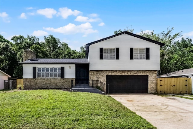 608 Pearl Rd, Winter Springs, FL 32708 - tri-level home with stone siding, a garage, driveway, a gate, and a chimney