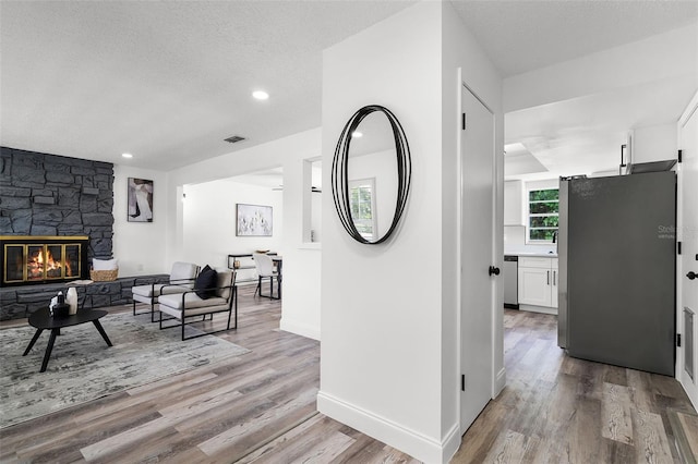 608 Pearl Rd, Winter Springs, FL 32708 - corridor featuring light wood-style floors, a textured ceiling, and recessed lighting