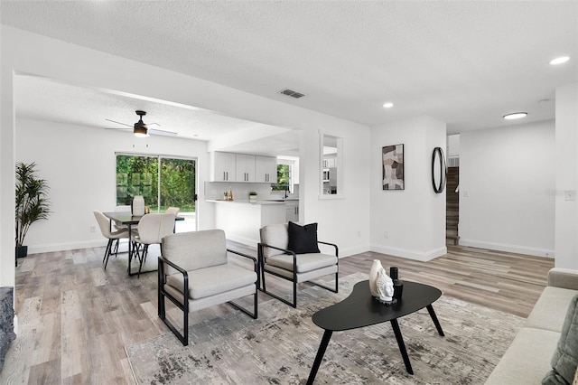 608 Pearl Rd, Winter Springs, FL 32708 - living area with ceiling fan, a textured ceiling, light wood-style flooring, and recessed lighting