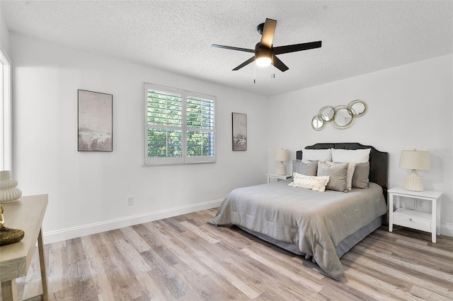 608 Pearl Rd, Winter Springs, FL 32708 - bedroom with wood finished floors, a textured ceiling, and a ceiling fan