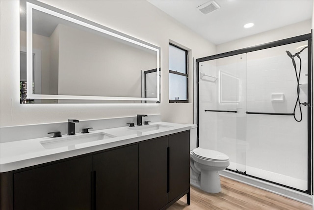 643 Princewood Dr, Deland, FL 32724 - full bathroom featuring a stall shower, double vanity, wood finished floors, and recessed lighting