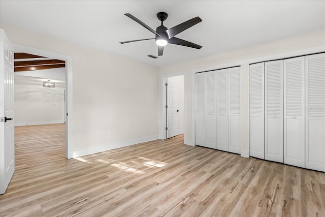 643 Princewood Dr, Deland, FL 32724 - unfurnished bedroom featuring two closets, light wood finished floors, and a ceiling fan