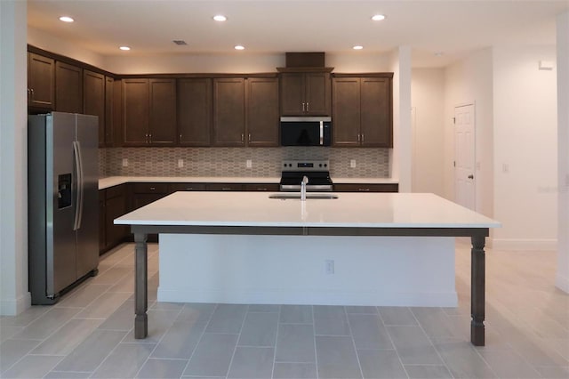 14568 Crestavista Ave, Clermont, FL 34714 - kitchen featuring stainless steel appliances, dark brown cabinetry, decorative backsplash, and recessed lighting