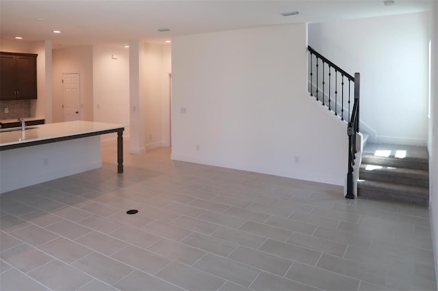 14568 Crestavista Ave, Clermont, FL 34714 - unfurnished living room with stairway and recessed lighting