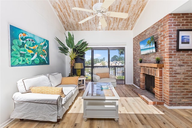 1051 S Highland St Unit 7D, Mount Dora, FL 32757 - living room featuring a fireplace, a ceiling fan, wood finished floors, and lofted ceiling